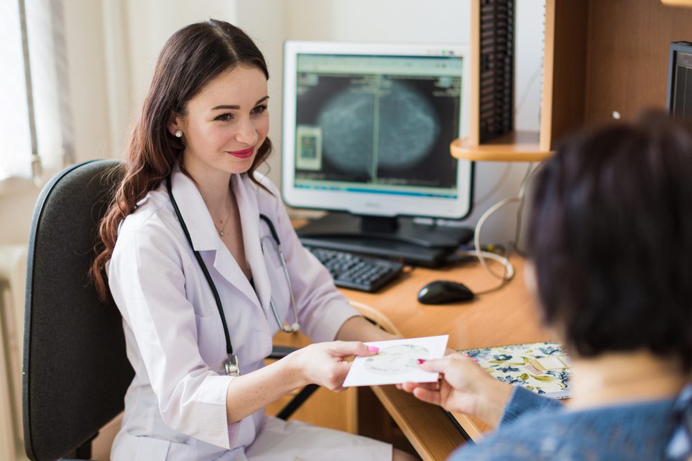 patient meeting with doctor for mammogram appointment